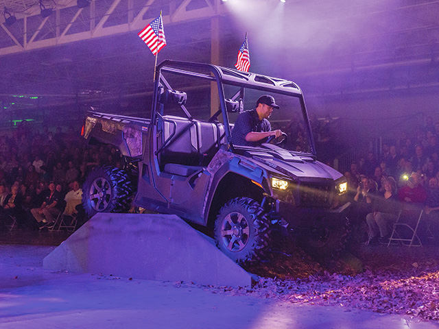 Country music star Luke Bryan drives a Tracker Off Road side-by-side during a dealer and employee launch event, Image provided by the manufacturer
